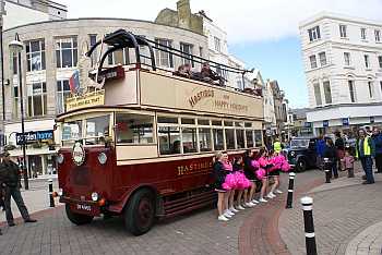 Hastings Trolley bus with Foyles War car behind 